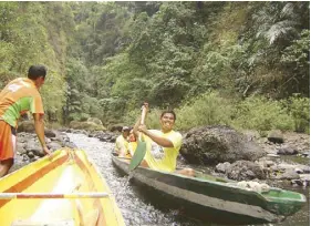  ??  ?? Shooting the rapids is a thrilling experience.