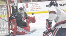  ?? TRURO NEWS PHOTO ?? Truro netminder Sebastien Plamondon deflects a puck during MHL action Saturday at the RECC. Plamondon turned aside 18 of 19 shots as the Bearcats defeated the visiting Valley Wildcats 5-1.