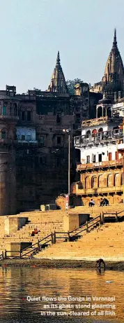  ??  ?? Quiet flows the Ganga in Varanasi as its ghats stand gleaming in the sun, cleared of all filth