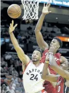  ?? ALAN DIAZ/AP ?? Raptors guard Norman Powell goes to the basket against a pair of Miami defenders on Saturday.