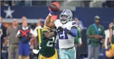  ?? ASSOCIATED PRESS ?? Ezekiel Elliott throws a lateral pass as Quinten Rollins gives chase in the final seconds of the game Sunday.