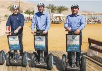  ?? (Tourism Ministry) ?? TOURISM MINISTER Yariv Levin (center) leads a Segway tour yesterday of the newly completed, 13-kilometer Dead Sea promenade.