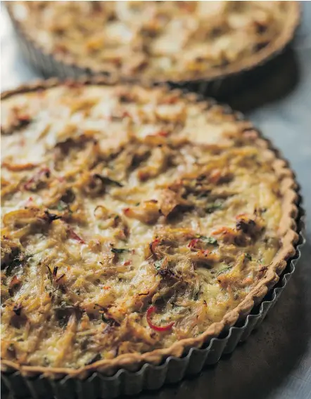  ?? FARAH KHAN/PNG FILES ?? A rich custard envelopes the delicate Dungeness crab and a bit of Parmesan cheese pulls the flavours together in this elegant tart.