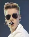  ?? WALTER BIERI/ KEYSTONE/ CP/ AP ?? Canadian singer Justin Bieber opened himself to ridicule after a visit to the Anne Frank House in Amsterdam.