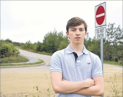  ?? SHARON MONTGOMERY-DUPE/CAPE BRETON POST ?? Glace Bay High School student Mitchell MacDonald stands on Ling Street at the exit of the one-way access road that leads to the high school. MacDonald believes the recent change to one-way status has caused safety and traffic concerns.