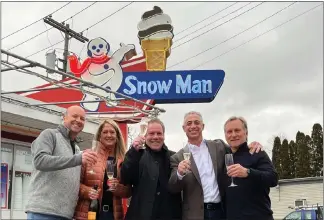  ?? PHOTO PROVIDED/FILE ?? Left to right: John Murphy, Christine Murphy, Jim Pettit, Martin Keary and Gene Coletti celebrate the sale of The Snowman in Troy.