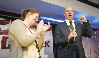  ?? CAROLYN KASTER/AP ?? State Sen. Doug Mastriano, a GOP Pa. governor candidate, speaks on primary night May 17 in Chambersbu­rg, Pa., with his wife, Rebecca.