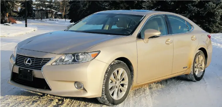  ?? Photos: Tim Yip/ Edmonton Journal ?? The 2013 Lexus ES300h Hybrid combines simple luxury inside the cabin with a bolder exterior featuring a new grille and large lower air intake up front and a sleek new shape that’s very aerodynami­c.