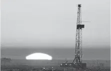  ?? [THE OKLAHOMAN ARCHIVES] ?? A drilling rig operates in Oklahoma’s Panhandle in 2005. Industry observers say it remains attractive for some oil and gas companies in the state to drill and produce vertical wells.