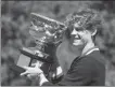  ?? AP ?? Jannik Sinner poses with Australian Open trophy in Melbourne on Jan 29.