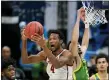  ?? JEFF ROBERSON — THE ASSOCIATED PRESS ?? USC’s Evan Mobley grabs a rebound in front of Oregon’s Chris Duarte during a March 28 NCAA tournament game in Indianapol­is.