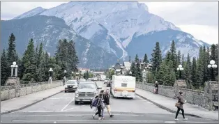  ?? CP PHOTO ?? From avoiding burned out workers to ensuring washrooms have enough toilet paper, documents show how Parks Canada painstakin­gly prepared for a record number of visitors to the country’s national parks this year. Smoke haze from forest fires burning in...