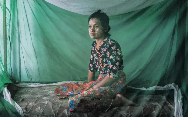  ?? ADAM DEAN / THE NEW YORK TIMES ?? Soe Chay, an ethnic Rakhine Buddhist from Myebon Township in Myanmar, was beaten and publicly shamed after her husband defied a blockade and delivered aid to Rohingya Muslims in their internment camp in Sittwe.