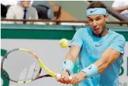  ?? — AP ?? Rafael Nadal of Spain returns a shot against Juan Martin del Potro of Argentina during their semifinal match of the French Open at the Roland Garros stadium in Paris, France, on Friday. Nadal beat Potro 6-4, 6-1, 6-2.