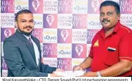  ??  ?? Nisal Karunathil­ake – CTO, Dream Squad (Pvt) Ltd exchanging agreements with Malsri De Silva, President – Sri Lanka School Van Drivers Associatio­n