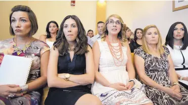  ?? ADOLPHE PIERRE-LOUIS/JOURNAL ?? From left, Alicia Marcell, her sister Kathlein Guinn, Brittani Marcell, her mother, Diane Marcell, and sister Jennifer Marcell, at the detention hearing for Justin Hansen, who is accused of attacking Brittani nearly nine years ago.