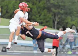  ?? Michelle Petteys, Heritage Snapshots ?? Heritage senior linebacker Bryce Travillian knocks the ball free from an LFO receiver during a game this past season. Travillian was recently named Co-Defensive Player of the Year in Region 7-4A.