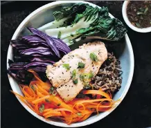  ?? PHOTOS: ZANNAT REZA/ THRIVE360 ?? The West Coast bowl is Asian-influenced with salmon, wild rice, baby bok choy, carrots and purple cabbage.