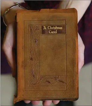  ??  ?? A leather-bound copy of Dickens’ A Christmas Carol from 1927