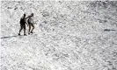  ?? Photograph: Lance King/Getty Images ?? People hike near Portage Lake in Girdwood, Alaska, on 4 July.