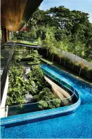 ?? Photograph: Guz Architects ?? The Singapore home sports a cascading waterfall.