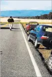  ?? Jim Schultz ?? The Record Searchligh­t Crime tape blocks a road into the Rancho Tehama subdivisio­n near Red Bluff, Calif., after a shooting Tuesday.