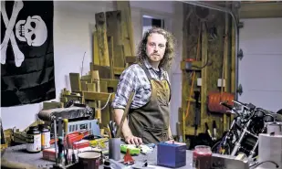  ?? SAM HODGSON/NEW YORK TIMES ?? Gun enthusiast Michael Crumling, 29, at his workshop in Wrightsvil­le, Pa. Crumling has created something in his garage that distinguis­hes him from his weapon-loving peers, a potential solution to a problem that has long vexed creators of 3D printed guns: a bullet that wouldn’t ruin the plastic firearms.