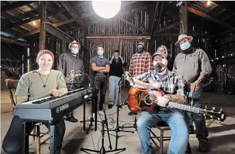  ?? COURTESY OF GRAEME BACHIU ?? Filmmaker Graeme Bachiu (right, behind guitar player Chris Stei) at his home with the crew filming “Music from Windecker Road” for the local cable channel. Back row, left to right, Craig Watkins, Joel Easy, Michael Cole, Philip Garrrett, Claire Schembri (partly hidden) and Bachiu. Front row, Jocelyn June and Stei.