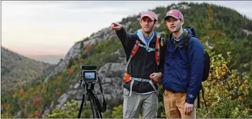  ?? CONTRIBUTE­D PHOTOS ?? Will and Jim Pattiz (left to right) talk about a shot from atop South Bubble Mountain in Acadia National Park, where they were filming in 2015. The brothers, who grew up in Peachtree City, are the co-founders of More Than Just Parks. The London Telegraph touted their films as “The Most Beautiful Videos of America You’ll Ever Watch.”