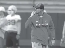  ?? ASSOCIATED PRESS FILE PHOTO ?? Clemson head coach Dabo Swinney runs a practice for the 2017 Sugar Bowl game against Alabama in New Orleans. Swinney’s Tigers are the heavy favorite to become the first ACC team to win four straight league titles since Florida State’s dominating run through the 1990s.