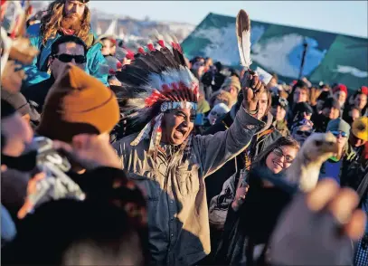  ?? PICTURE: AP ?? A crowd gathers in celebratio­n at the Oceti Sakowin camp after it was announced that the US Army Corps of Engineers won’t allow an oil pipeline to be built in Cannon Ball, North Dakota.