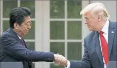  ?? Tom Brenner/The New York Times ?? President Donald Trump and Prime Minister Shinzo Abe of Japan hold a joint news conference Thursday in the Rose Garden of the White House.