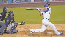  ?? ASHLEY LANDIS/ASSOCIATED PRESS ?? The Dodgers' Corey Seager bats against the Brewers on Thursday in Los Angeles. The Dodgers won the NL Wild Card series.