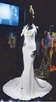  ??  ?? John Galliano’s surreal mermaid-line sheath dress (SS 1999)