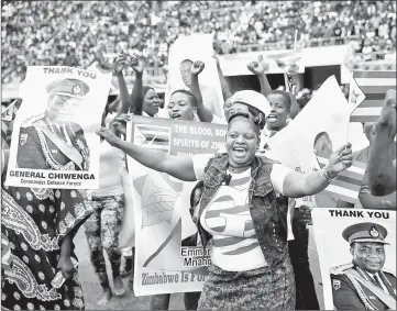  ??  ?? People cheer as Mnangagwa is sworn in as Zimbabwe President in Harare. — Reuters photo