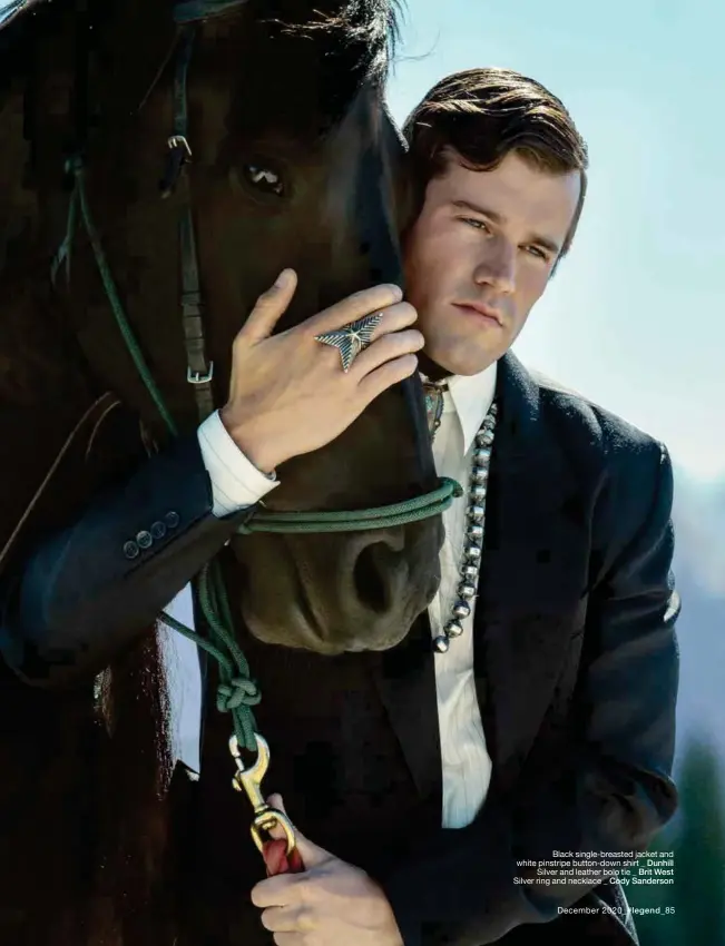  ??  ?? Black single-breasted jacket and white pinstripe button-down shirt _ Dunhill
Silver and leather bolo tie _ Brit West
Silver ring and necklace _ Cody Sanderson