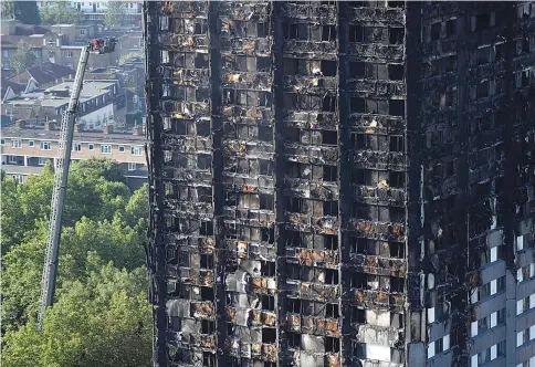  ?? — Reuters photo ?? Damage is seen to a tower block which was destroyed in a fire disaster in north Kensington, West London, Britain.