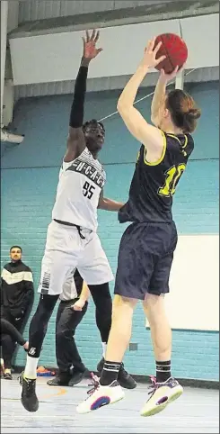  ?? ?? Above, North School Lions’ Kacper Pedich elevating for a jump shot against Folkestone Academy. Left, Lions’ Iain Bremer on a drive to a basket against Folkestone Academy