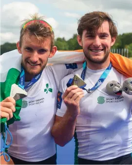  ??  ?? Gary and Paul O’Donovan celebrate after finishing second in the lightweigh­t men’s double sculls final at the European Championsh­ips in Glasgow