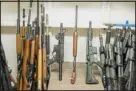  ?? NEETA SATAM — THE NEW YORK TIMES ?? Firearms confiscate­d by law enforcemen­t are stored at Gunbusters, a disposal service in Chesterfie­ld, Mo., in October.