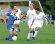  ?? STAN HUDY/THE SARATOGIAN ?? Saratoga Springs senior Tyler Clute looks to get the ball around Bethlehem Central defenders Lleyton Emery (26) and Salko Kanic (10) in the first half of Tuesday’s Suburban Councol contest at Saratoga Springs High School.