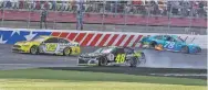  ?? CHUCK BURTON/ASSOCIATED PRESS ?? Ryan Blaney, left, drives past the wrecked cars of Jimmie Johnson, center, and Martin Truex Jr. to win the NASCAR Cup series race Sunday at Charlotte Motor Speedway in Concord, N.C.