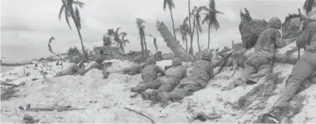  ?? | SUN-TIMES LIBRARY PHOTOS ?? Marines on the beach at Tarawa take their positions to attack the airport.