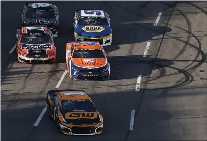  ?? JAMES GILBERT — GETTY IMAGES ?? Kurt Busch (1), Brad Keselowski (2), Aric Almirola (10), Chase Elliott (9) and Corning’s Tyler Reddick (8) race during the NASCAR Cup Series Blue-Emu Maximum Pain Relief 500at Martinsvil­le Speedway on Sunday in Martinsvil­le, Va.