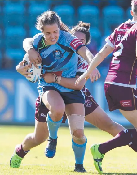  ?? Picture: AAP IMAGES ?? NSW’s Isabelle Kelly is brought down by Queensland during the women’s interstate challenge.