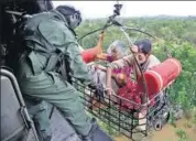  ?? REUTERS ?? People being rescued by the Indian Navy in Kerala on Friday