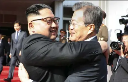  ?? SOUTH KOREA PRESIDENTI­AL BLUE HOUSE — YONHAP VIA AP ?? North Korean leader Kim Jong Un, left, and South Korean President Moon Jae-in embrace each other after their meeting at the northern side of the Panmunjom in North Korea, Saturday. Kim and Moon have met for the second time in a month to discuss peace commitment­s they reached in their first summit and Kim’s potential meeting with President Donald Trump.