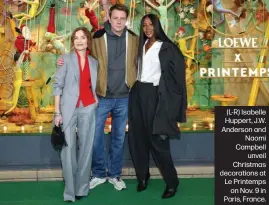  ?? ?? (L-R) Isabelle Huppert, J.W. Anderson and Naomi Campbell unveil Christmas decoration­s at Le Printemps on Nov. 9 in Paris, France.