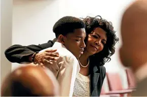  ?? AP ?? Dallas County District Attorney Faith Johnson hugs Kevon Edwards, the older brother of Jordan Edwards, who was shot and killed by a police officer.