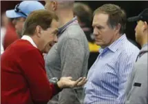  ?? ASSOCIATED PRESS FILE PHOTO ?? Coach Nick Saban, left, speaks with New England Patriots coach Bill Belichick during Alabama’s pro day at the Hank Crisp Indoor Facility in Tuscaloosa, Ala., in March.